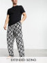Фото #1 товара ASOS DESIGN pyjama set with t-shirt and trousers in black with fleece printed bottom