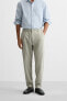 TEXTURED PLEATED TROUSERS