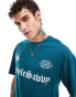 Фото #1 товара ADPT oversized t-shirt with football inspired chest print in green