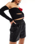 In The Style leather look stretch waist shorts in black