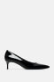 Heeled shoes with a faux patent finish