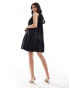 Фото #1 товара & Other Stories sleeveless mini dress with tiered hem and back bow tie in black