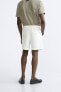 TEXTURED COTTON BERMUDA SHORTS