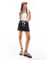 Фото #2 товара ASOS DESIGN pull on short with contrast panel in black