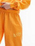 Фото #11 товара Topshop co-ord nyc project puff printed vintage wash oversized jogger in orange