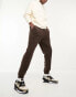 ASOS DESIGN tapered fleece joggers in brown