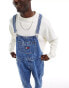 Tommy Jeans denim dungarees in mid wash