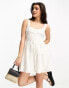 ASOS DESIGN tiered skater playsuit in white broderie weiß, 38 - фото #2