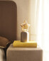 Children’s table lamp with star light bulb