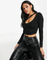 Фото #1 товара ASOS DESIGN asymmetric crop top with long sleeve and keyhole in black