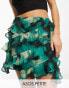 Фото #1 товара ASOS DESIGN Petite ruffle chiffon mini skirt in green abstract print