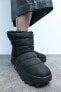 Flat quilted ankle boots with faux shearling