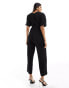 Y.A.S plisse wrap front jumpsuit in black