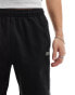 Lacoste tapped jersey shorts in black