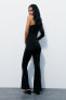 Flared polyamide asymmetric jumpsuit