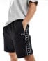 Lacoste tapped jersey shorts in black