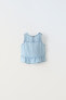 Denim top with ruffled back