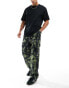 ASOS DESIGN smart wide leg cargo trousers in khaki camo print