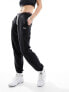 Фото #1 товара Tommy Jeans relaxed script joggers in black