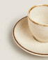 Porcelain coffee cup with antique finish rim