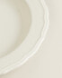 Earthenware soup plate with raised-design edge