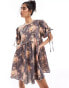 Фото #1 товара & Other Stories mini smock dress with tie detail volume sleeves in textured floral print