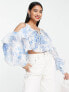 ASOS DESIGN ruffle blouse with lace up back in blue floral