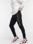 Фото #7 товара Tommy Hilfiger embroidered logo cuffed joggers in black