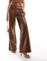 ASOS DESIGN leather look wide leg trousers in animal