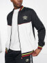 Umbro Global tricot tracksuit in black and white