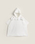 Children’s poncho with floral embroidered collar