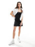 Фото #1 товара Tommy Jeans flared ribbed mini dress in black