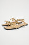 Flat slider sandals with bows