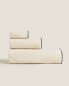 Cotton towel with overlock