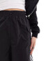 adidas Originals three stripe cargo shorts in black