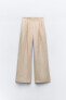 Loose fit pleated trousers