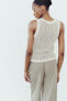 Sleeveless metallic thread knit top