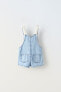 Short dungarees with crochet motifs