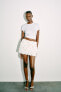 Фото #1 товара Мини-юбка из полупрозрачной ткани с цветочным принтом ZARA