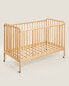 Engraved wooden cot