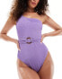 Фото #1 товара In The Style exclusive crinkle one shoulder ring belt detail swimsuit in purple