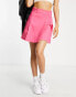 ASOS DESIGN Petite pleated mini skirt in cerise pink