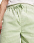 ASOS DESIGN wide cord shorts in shorter length in light green