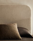 Rounded headboard with linen cover