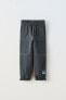 Фото #1 товара Комбинированные брюки из мягкой ткани ZARA