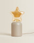 Children’s table lamp with star light bulb