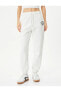Фото #3 товара Спортивные брюки Koton Jogger с поясом, с карманами, с принтом