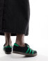 adidas Originals London trainers in black and green