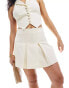 Edited pleated mini skirt co-ord in cream