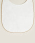 Velour baby bib with trim detail